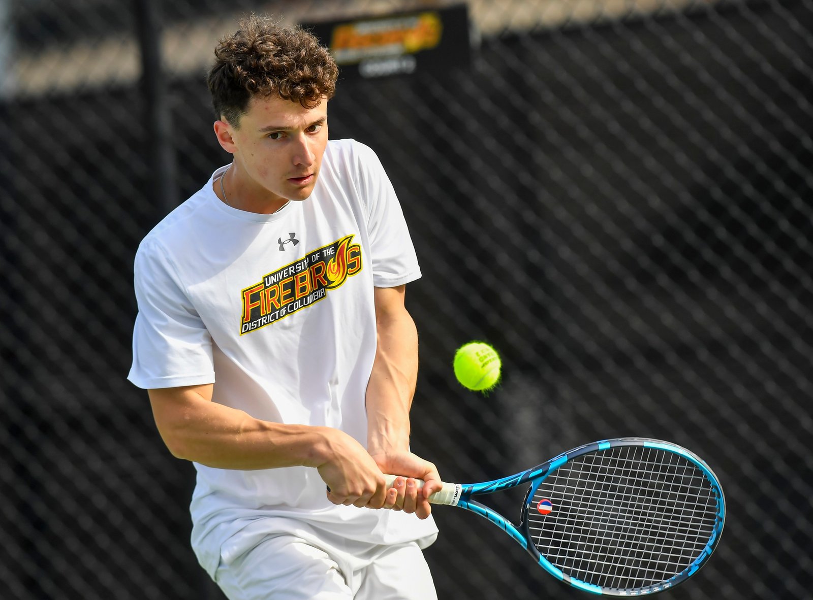 Eyes locked on the ball at contact — the focus behind feel